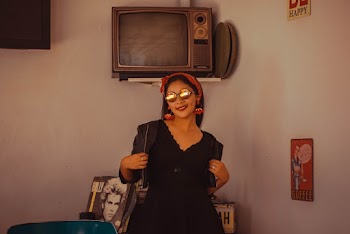 Woman Wearing Black V-neck Dress and Sunglasses