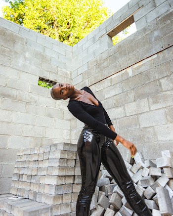 Woman Wearing Black V-neck Long-sleeved Shirt and Leather Leggings