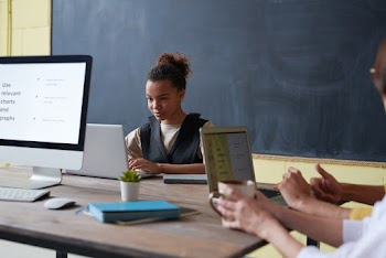 Woman Wearing Black Vest Using Silver Macbook Pro