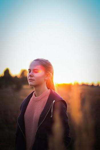 Woman Wearing Black Zip-up Jacket during Golden Hour