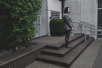 Woman Wearing Blazer Standing Near Green Plant