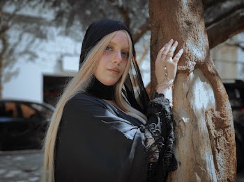 Woman Wearing Blck Dress With Scaft