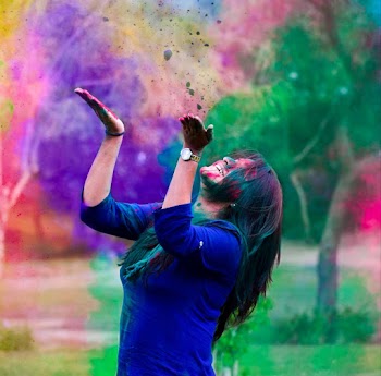 Woman Wearing Blue 3/4-sleeved Shirt Throwing Colored Powders