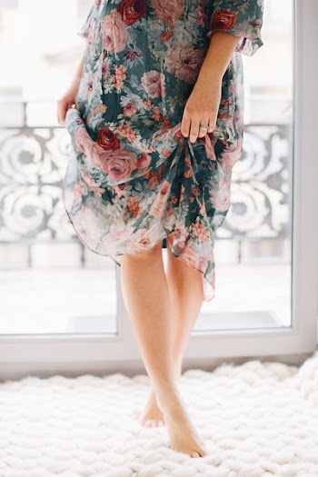 Woman Wearing Blue and Brown Floral Dress