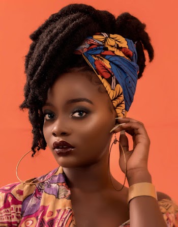 Woman Wearing Blue and Brown Floral Head Wrap