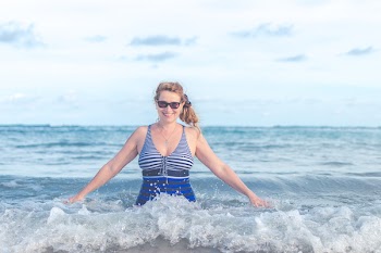 Woman Wearing Blue and Grey Swimsuit on Ocean