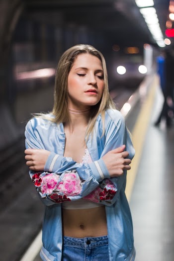 Woman Wearing Blue and Pink Floral Long-sleeved Shirt Inside Subway
