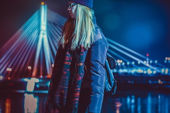 Woman Wearing Blue and Red Leather Jacket