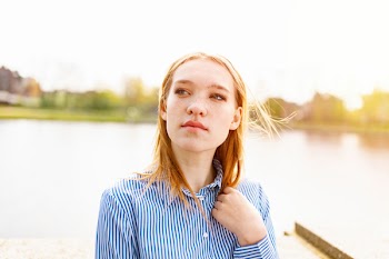 Woman Wearing Blue-and-white Pinstriped Button-up Collared Shirt