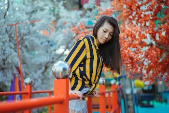 Woman Wearing Blue and Yellow Pinstriped Shirt