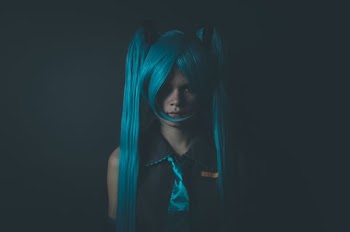 woman wearing blue anime suit