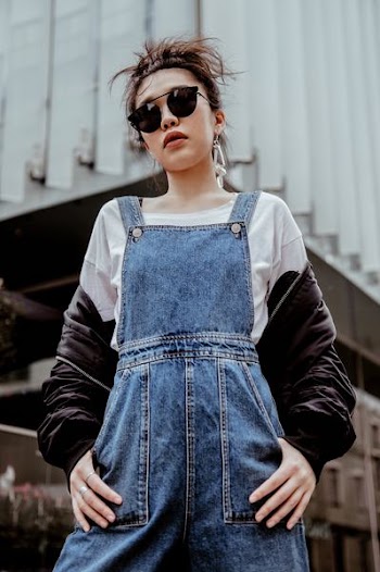 woman wearing blue denim dungarees