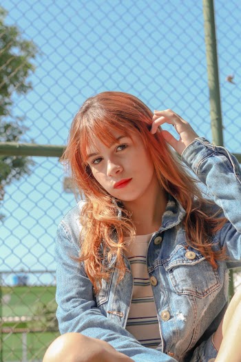 Woman Wearing Blue Denim Jacket