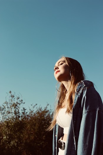 Woman Wearing Blue Denim Jacket