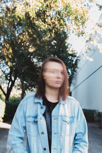 woman wearing blue denim jacket