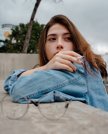 Woman Wearing Blue Denim Jacket