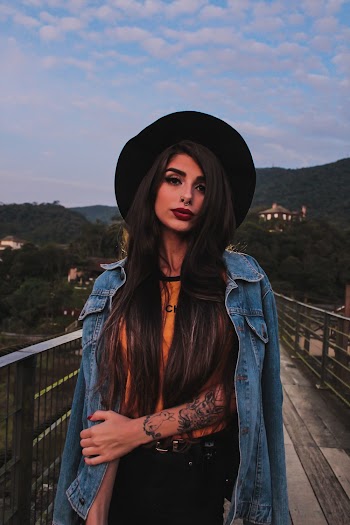 Woman Wearing Blue Denim Jacket and Black Hat