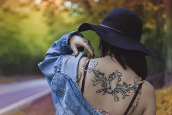 Woman Wearing Blue Denim Jacket And Hat Near Road