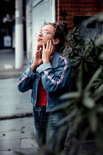 Woman Wearing Blue Denim Jacket and Jeans