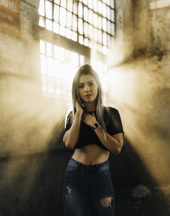Woman Wearing Blue Distressed Jeans