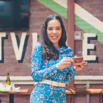 Woman Wearing Blue Floral Long-Sleeved Dress
