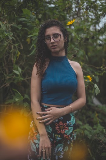 Woman Wearing Blue Haltered Top And Floral Pants