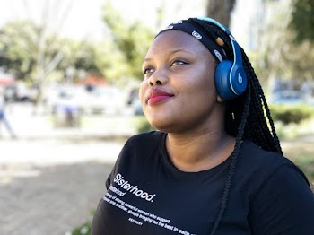 Woman Wearing Blue Headphones