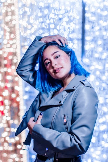 Woman Wearing Blue Leather Jacket