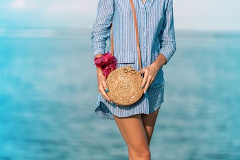 Woman Wearing Blue Long-sleeved Button-up Dress And Brown Sling Bag