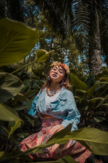 Woman Wearing Blue Long-sleeved Jacket and Red Floral Skirt