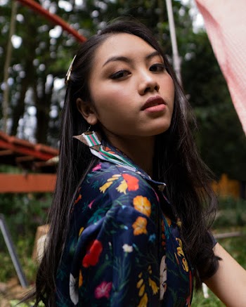 Woman Wearing Blue, Red, and Yellow Shirt
