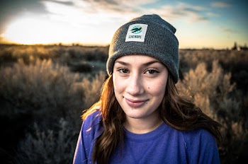 Woman Wearing Blue Shirt And Grey Beanie