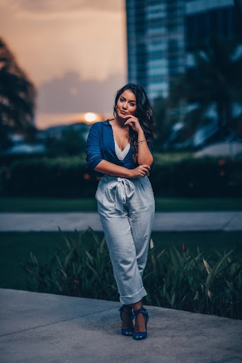 Woman Wearing Blue Top and Gray Candypants