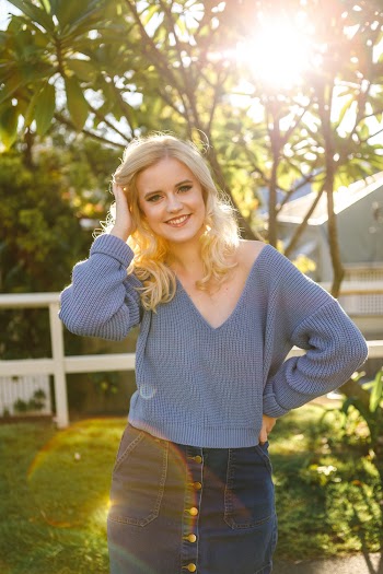 Woman Wearing Blue V-neck Sweater