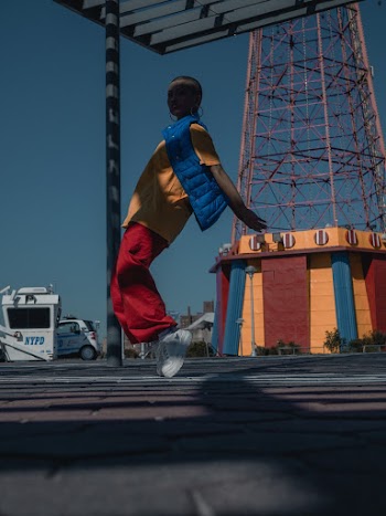 Woman Wearing Blue Vest Hopping