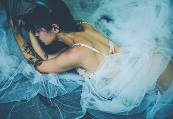 Woman Wearing Bra and Panty With Mesh Lying on Ground