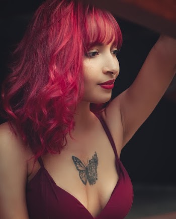 Woman Wearing Bra With Butterfly Tattoo On Chest
