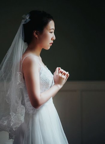 woman wearing bridal gown