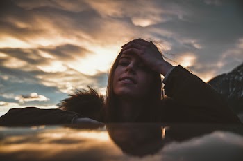 Woman Wearing Brown and Green Parka at Golden Hour