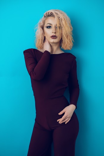 Woman Wearing Brown Bodysuit