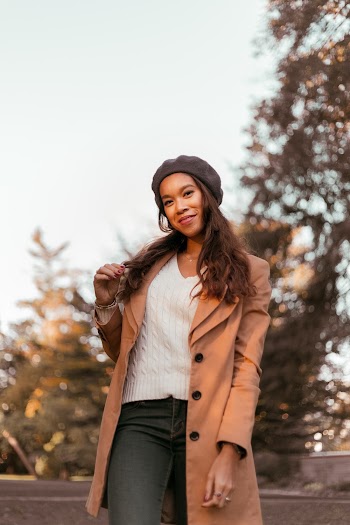 Woman Wearing Brown Coat and Black Denim Jeans