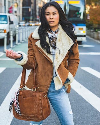Woman Wearing Brown Coat Holding Brown Bag