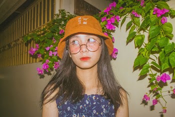 Woman Wearing Brown Hat and Eyeglasses