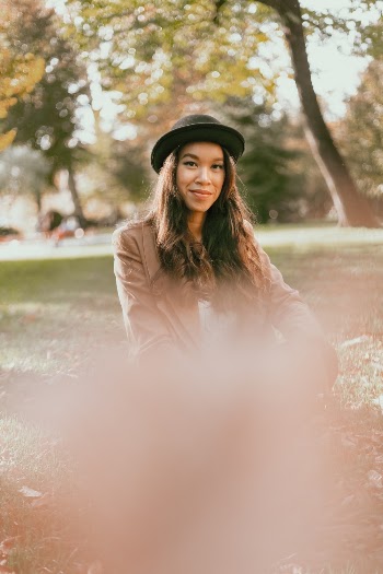Woman Wearing Brown Jacket and Hat