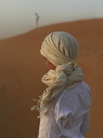 Woman wearing brown scarf