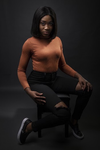 Woman Wearing Brown Sweater and Black Pants