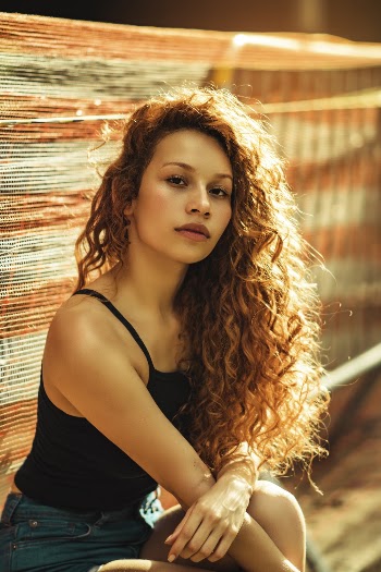 Woman Wearing Camisole Beside Textile