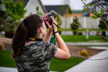 Woman Wearing Camouflage Scoop-neck Shirt