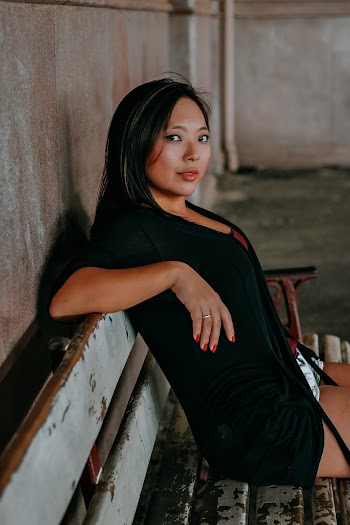 Woman Wearing Cardigan Sitting on Bench