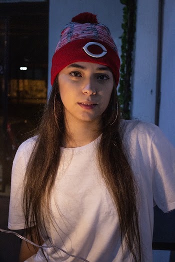 Woman Wearing Cincinnati Red Bobble Cap